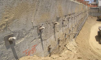 Photo. This photo shows an excavation utilizing nonmetallic tiebacks on the sidewalls.