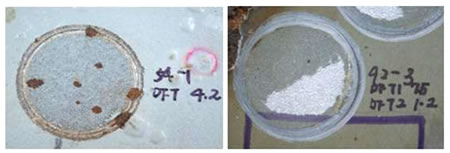 Figure 18. Photo. Cohesive failure modes of ASP and EM. This photo shows the coating surface on polyaspartic (ASP) and epoxy mastic (EM) panels after adhesion strength testing was performed. Both these coating systems demonstrated cohesive failure modes, meaning that the coating system had an adhesively well-bonded primer to the steel substrate in comparison to the adhesion bonding between the coating layers. ASP had a remaining dry film thickness (DFT) of 4.2 mil (106.68 ), and EM had a remaining DFT of 1.5 mil (38.1 ) on the surface.