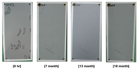 Figure 46. Photo. Progressive changes of panel 202 (WBEP: NW). This figure shows a series of photos of scribed waterborne epoxy (WBEP) panel 202 at time periods of 0, 7, 13, and
18 months of natural weathering (NW) exposure. The photos do not show any holidays or surface deterioration. The test panel had initial defects on the surface but did not develop any further defects through the test period. Rust creepage growth appears to be minimal or zero for all time periods.