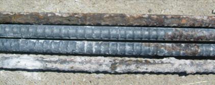 Some of the top bars have corrosion losses that are well above 25 µm (0.98 mil), and the corrosion products are not uniformly distributed over the surface of the bars. Corrosion covers only about 40 percent of the total bar area