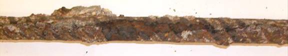 Severe corrosion is observed over the entire bar surface, with some sections exhibiting visible reductions in rib area.