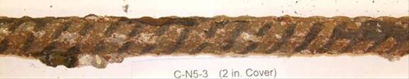 Severe corrosion is observed over the entire bar surface, with some sections exhibiting visible reductions in rib area.