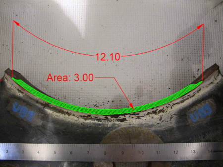 This photo shows the fracture surface. The crack has a total length of 12.10 inches along the outside diameter of the tube and a total area of 3.00 square inches.