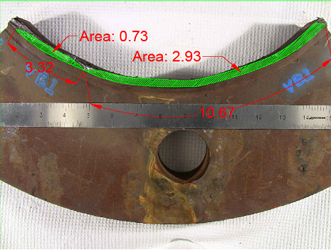This photo shows the fracture surface. There were two cracks that grew together elliptically, just touching each other at the surface of the tube. The larger crack is 10.67 inches along the outside diameter of the tube and has a total area of 2.93 square inches. The smaller crack is 3.32 inches along the outside of the tube and has a total area of 0.73 square inches.