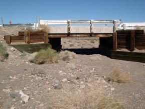 Figure 47. Rt. 66 Wash, Basin and Range-looking downstream at bridge. Photo. This is looking downstream at the bridge. The channel is completely dry and lacks definition. 