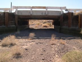 Figure 48. Rt. 66 Wash, Basin and Range-looking upstream at bridge. Photo. This photo looks upstream at the bridge at a very poorly defined channel boundary.