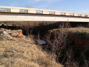 Figure 85. Beaver Creek, Central Plains-facing downstream under bridge. Photo. This is looking downstream under the bridge. The photo shows degradation with respect to the bridge.