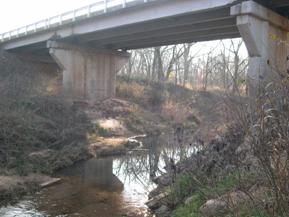 Figure 92. Unnamed creek (N 19), Central Plains-downstream under bridge. Photo. This is looking downstream under the bridge. 