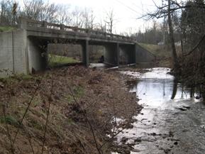 Figure 99. Honey Run, Interior Low Plateau-looking upstream at bridge. Photo. This is looking upstream at the bridge. The photo shows the high angle of exit. 