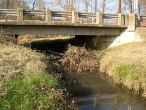 Figure 116. Unnamed creek (N 21), Ozark-Ouachita Highlands-looking upstream at bridge. Photo. This is looking upstream at the bridge. 