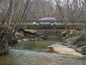 Figure 139. Stocketts Run, Atlantic Coastal Plain-looking downstream at bridge. Photo. This is looking downstream at the bridge. The channel is well-aligned with the bridge.