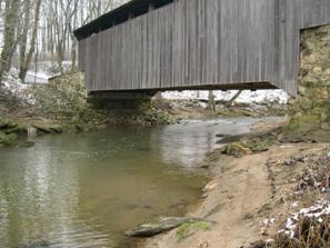 Figure 223. Little Elk Creek, Piedmont-looking upstream at bridge. Photo. This is looking upstream at the covered bridge. Although the bridge is midway between two meander bends, it is fairly well-aligned with the channel. 