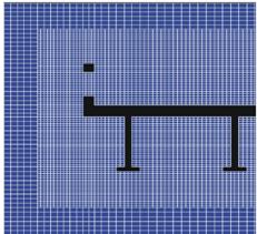 Figure 17. Diagram. Partially refined mesh for STAR-CD® simulation. This diagram shows a truncated cross section of the six-girder bridge in black. The leading edge of the bridge including railing up to the second girder is shown on a blue background. A regular set of white gridlines is imposed over the background. In the vicinity of the bridge cross section, the grid size is twice as fine.