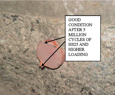 This photo shows a cross section of the slab at joint location for pavement slab number 4 where slabs across the joints are separated by cutting the FRP dowel. The fiber reinforced polymer dowel bar and concrete interface is in good shape with no visible micro cracks after 5 million cycles of HS25 or higher loading.