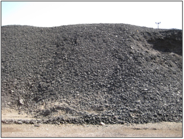 Figure 12. Photo. Stockpile of unprocessed RAP millings. Click here for more information.