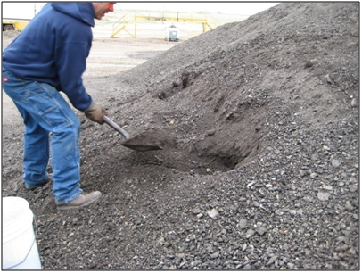 Figure 19. Photo. Sampling RAP from the stockpile. Click here for more information.