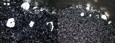 This photo shows black, loose hot mix asphalt with uncoated white nuggets of lime.
