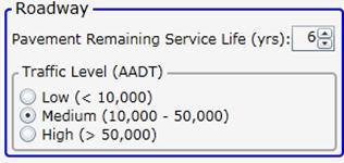 This screenshot shows the roadway area of the input section of the pavement marking selection tool, with a drop-down menu for pavement remaining service life in years and radio buttons for low, medium, and high traffic level (average annual daily traffic (AADT)).