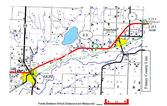 This figure shows a screenshot of a map of Kearny County, KS. Green circles along route US 50 have been added to the screenshot to help identify the asterisk symbols at the beginning and end of the segment used in the evaluation and to identify the distance indication for the segment (9.9 mi).