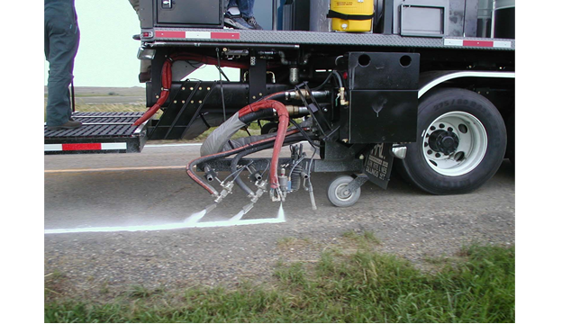 Application of glass beads to long line markings. The image illustrates an automatic bead drop delivery system that place beads onto the marking material in a continuous process.