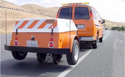 This photo shows a Dynaflect deflection device conducting a testing sequence on a pavement.