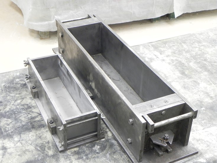 FIGURE 3. View of small and standard molds. This image shows the two sizes of beam side-by-side to illustrate the difference in size. FIGURE 3. View of small and standard molds. This image shows the two sizes of beam side-by-side to illustrate the difference in size.