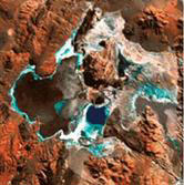 Figure 4. Photo. Aerial view of lithium-bearing brines in Argentina (Salar del Hombre Muerto). The image shows a mountainous terrain.