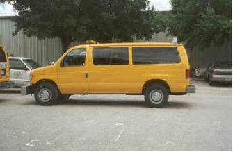 This figure shows a photograph of the International Cybernetics Corporation (ICC) MDR 4086L3 profiler. The sensor bar that houses the height sensors is located on the front of the vehicle. The vehicle is shown from the side, and the sensor bar can be seen on the front hanging where the bumper normally would be.