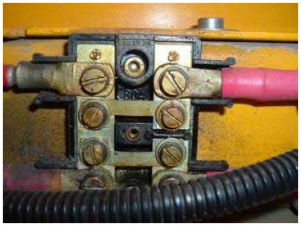 Photograph shows a trailer fuse block, one of three fuse blocks open parenthesis two others are inside the vehicle close parenthesis that need to be cleaned and inspected monthly.