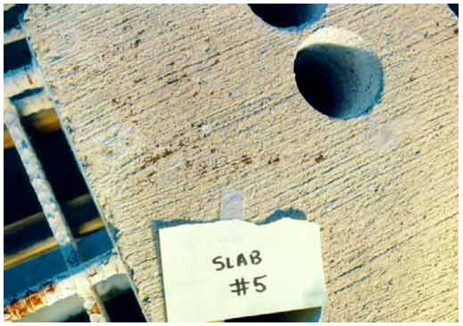 Figure 16. Photo. Rust stains on the top surface of slab 5. This photograph shows rust stains on the surface of slab 5 that were not accompanied by cracks.