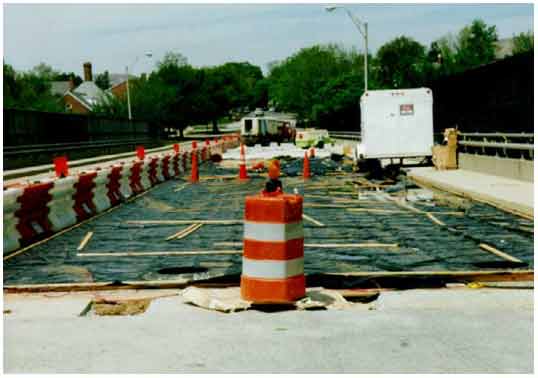 Figure 33. Photo. Northern half of the eastbound lane of 34th Street bridge in Arlington, VA, during ECE treatment. This photograph shows a general view of the northern half of the eastbound lane of the 34th Street bridge in Arlington, VA, during electrochemical chloride extraction (ECE) treatment.