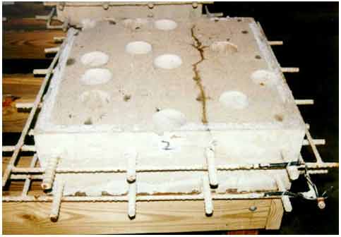 Figure 4. Photo. Condition of crack on the top surface of slab 2 in August 1994. This photograph shows a surface crack formed along a top mat rebar of slab 2.