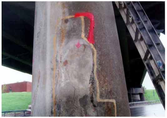 Figure 42. Photo. First view of a completely delaminated patch (marked in yellow) on a column of the Campus Loop Bridge in Albany, NY. This photograph shows a completely delaminated patch marked in yellow on a column of the Campus Loop Bridge in Albany, NY.