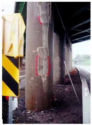 Figure 43. Photo. Second view of a completely delaminated patch (marked in yellow) on a column of the Campus Loop Bridge in Albany, NY. This photograph shows a second view of a completely delaminated patch marked in yellow on a column of the Campus Loop Bridge in Albany, NY.