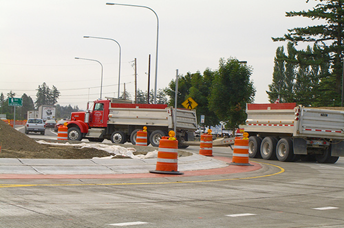 Figure 5. Photo. Seven-axle Class 10 truck. This photo shows a large seven-axle, Class 10 truck. It is a Singleâ€“Tridem configured dump truck pulling a tridem axle equipped dump trailer 