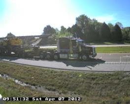 Figure 37. Photo. Class 13 truck with a second articulated connection. This photo shows a Class 13 truck consisting of a four-axle tractor pulling a trailer with the extra articulated connection.