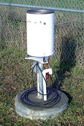 Figure C.1. Photo. Heated tipping bucket rain gauge.