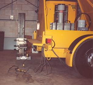 Figure 6.8. Photo. Calibration equipment being used on a falling weight deflectometer.