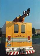 Figure 6.9. Photo. Photographic distress equipment van, rear view, with extended overhead camera boom.