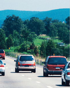 Photo. Blurred image of heavy traffic on highway.