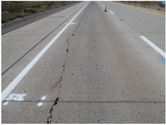 Figure 21. Photo. Longitudinal cracking near the shoulder in Arizona-0213 section (February 16, 2011).