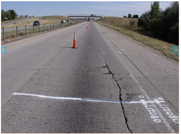 Figure 25. Photo. Longitudinal cracking near the shoulder in Colorado-0217 section (September 20, 2011).