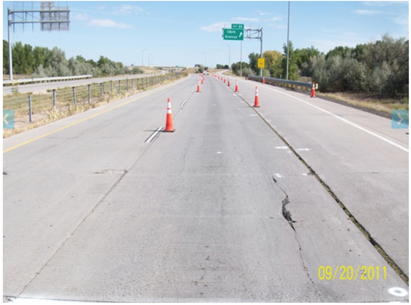 Figure 26. Photo. Longitudinal cracking near the shoulder in Colorado-0218 section (September 20, 2011).