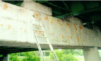 Photo C shows the north pier and one interior circular concrete column. The photos do not show any visible difference in the piers or columns. 