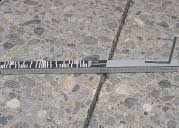 FIGURE 133.  Distress Type CRCP 15 - Longitudinal Joint Seal Damage, Color photograph of continuously reinforced concrete pavement with distress type CRCP 15 - longitudinal joint seal damage.  The picture is a close-up view of approximately 250 mm of the length of a longitudinal joint.  There is a loss of sealant to a depth of approximately 25 mm, as indicated by the 500-mm scale in the center of the photograph.  