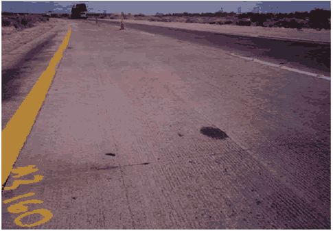 In the photograph, two lanes and the shoulder are visible.