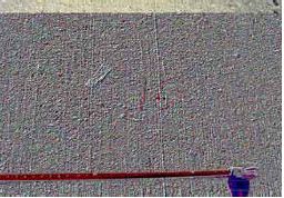 The figure consists of two sets photographs. The first set consists of six photographs of Shakespeare aggregate. Photograph 6 A shows the 1 percent lithium hydroxide, 6 B shows the 0.5 percent lithium hydroxide, 6 C shows the Lomar, 6 D shows the Class F Ash, 6 E shows the Class C Ash, and 6 F shows the control. The next set consists of five photographs of Grevey Aggregate. Photograph 6 G shows Blended C and F Ash, 6 H shows Class F Ash, 6 I shows the control, 6 J shows the 1 percent lithium hydroxide, and 6 K shows the Class C Ash. Each photograph shows a tape measure for comparison.