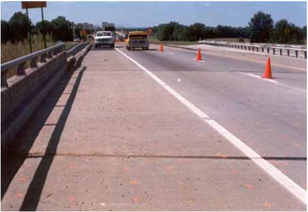 Photograph showing I-265 southbound lanes with silica fume-modified concrete overlay.