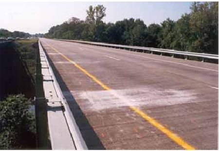 Photograph showing the eastbound deck of U S 52 over Raymond Run in Columbus, Ohio. The overlay is latex-modified.