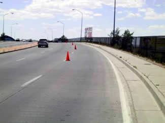 Figure 15. Photo. General View of Lomas Boulevard Experimental Pavement. This photo shows three lanes of pavement